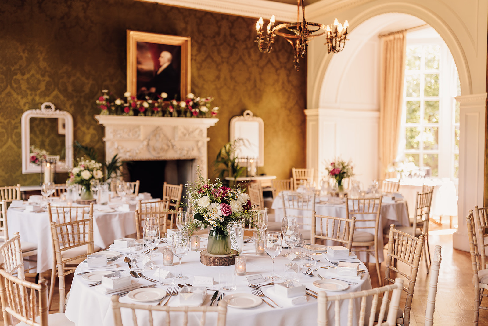 Grays Court Dining room, set up in an elegant fashion with circular tables and fine dining plates with centrepieces