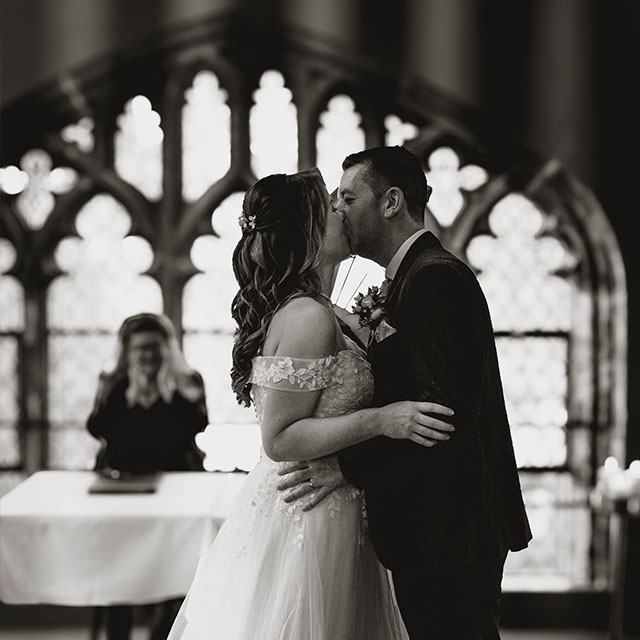 York Minster Refrectory wedding venue, couple kissing during ceremony